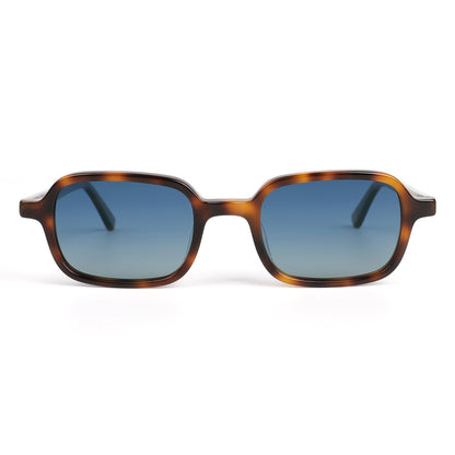 Alkira branded sunglasses with tortoiseshell frame and blue lenses on a white background