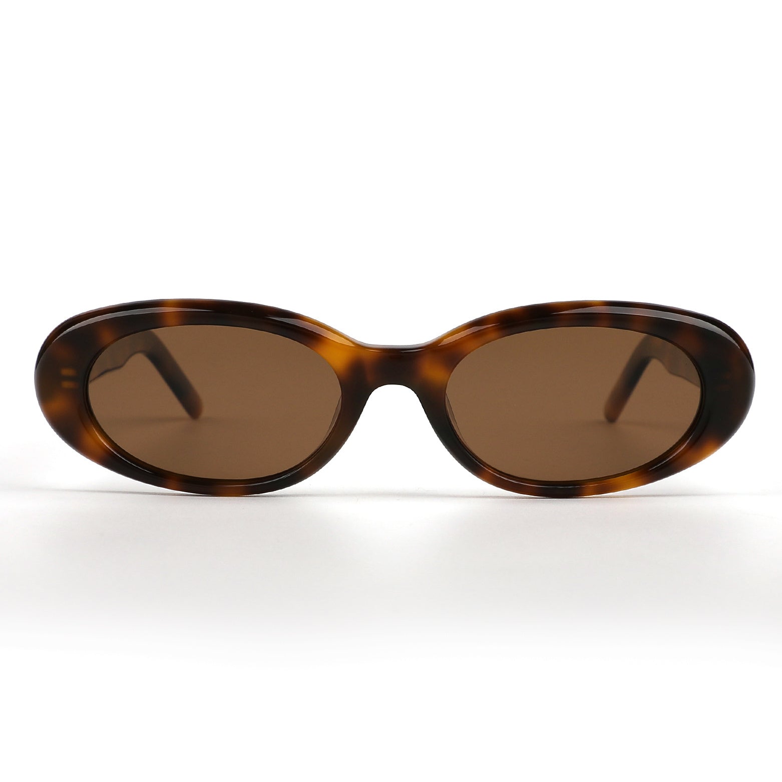 Alkira branded sunglasses with tortoiseshell frame and brown lenses on a white background